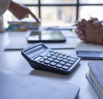 team-of-confident-business-people-point-to-graphs-2025-02-21-14-49-03-utc