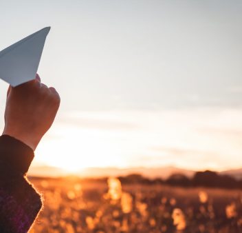 traveling-woman-with-paper-airplane-plays-at-the-l-2025-01-29-03-10-18-utc